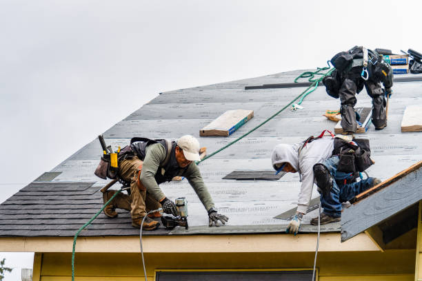 Professional Roofing technician working in Bedford, MA